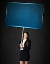 Businesswoman with blue board Royalty Free Stock Photo