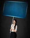 Businesswoman with blue board Royalty Free Stock Photo