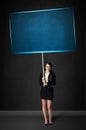 Businesswoman with blue board Royalty Free Stock Photo