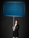 Businesswoman with blue board Royalty Free Stock Photo