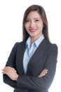 A businesswoman in a blue shirt and gray suit arms crossed with a smiling face Royalty Free Stock Photo