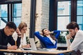 Businesswoman relax while her colleagues working Royalty Free Stock Photo