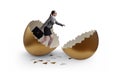 Businesswoman breaking out of golden egg