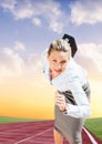 Businesswoman with briefcase running on race track Royalty Free Stock Photo