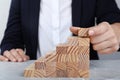 Businesswoman building steps with wooden blocks at table. Career ladder