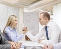 Businesswoman and businessman arm wrestling Royalty Free Stock Photo