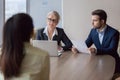 Businesswoman and businessman HR manager interviewing lady