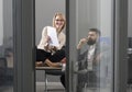 Businesswoman and businessman write business plan. Concentrated on work. Sensual woman and bearded man work together in