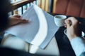 Businesswoman in a cafe with a book on the table documents a cup of coffee work lifestyle