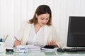 Businesswoman Calculating Bills Royalty Free Stock Photo