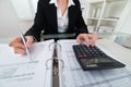 Businesswoman Calculating Invoice Royalty Free Stock Photo