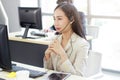 Businesswoman Call Center and technical Support staff with headset thiking and talking in work. Asian customer support team