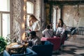 Businesswoman came up to get colleagues opinion during break in the dining room