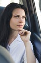 Businesswoman in car. Modern woman. Woman in car looking at wind