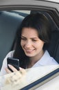 Businesswoman in car. Modern woman. Woman in car with phone.