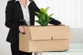 Businesswoman Carrying Her Belongings Royalty Free Stock Photo