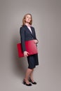 Businesswoman carrying portfolio