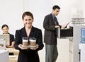 Businesswoman carrying tray of coffee