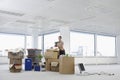 Businesswoman With Cartons Moving Into New Office Royalty Free Stock Photo