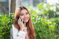 Businesswoman in casual cloth talking on mobile phone outside of Royalty Free Stock Photo