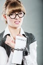 Businesswoman with chained hands holding contract