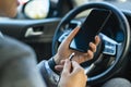 businesswoman charging her phone car. High quality photo