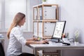 Businesswoman Checking Invoice On Computer Royalty Free Stock Photo