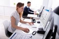 Businesswoman Checking Invoice On Computer Royalty Free Stock Photo