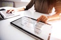 Businesswoman Checking Invoice On Digital Tablet Royalty Free Stock Photo