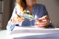 Businesswoman Checking Invoice With Magnifying Glass Royalty Free Stock Photo