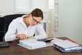 Businesswoman Checking Invoice With Magnifying Glass Royalty Free Stock Photo