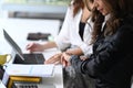 Businesswoman checking time on her smart watch while sitting in the meeting room. Royalty Free Stock Photo