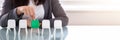 Businesswoman Choosing Green Chair Among White Chairs In A Row Royalty Free Stock Photo