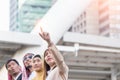 Businesswoman with clicked her finger on building background. Business and Teamwork concept.