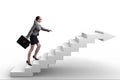 The businesswoman climbing career ladder in business concept