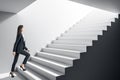 Businesswoman climbing stairs