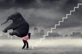 Businesswoman climbing stairs with elephant Royalty Free Stock Photo