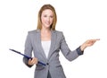 Businesswoman with clipboard and finger point aside Royalty Free Stock Photo