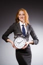 Businesswoman with clock