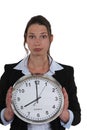 Businesswoman with a clock