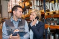 Businesswoman and colleague working in warehouse Royalty Free Stock Photo