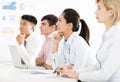 Businesswoman with colleagues in meeting room Royalty Free Stock Photo