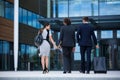 Businesswoman with colleagues walking