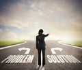 Businesswoman at a crossroads. She chooses the correct way. Concept of decision in business