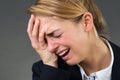 Businesswoman Crying Over Gray Background Royalty Free Stock Photo