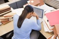 Businesswoman in cubicle with laptop