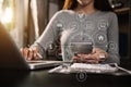 Businesswoman or Designer using mobile phone with laptop and digital tablet laptop and document on desk in office with virtual Royalty Free Stock Photo
