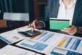 Businesswoman on desk in office using calculator to calculate sa Royalty Free Stock Photo