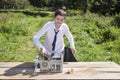 Businesswoman destroys the computer with a hammer