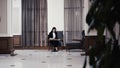 Businesswoman with documents in lobby of